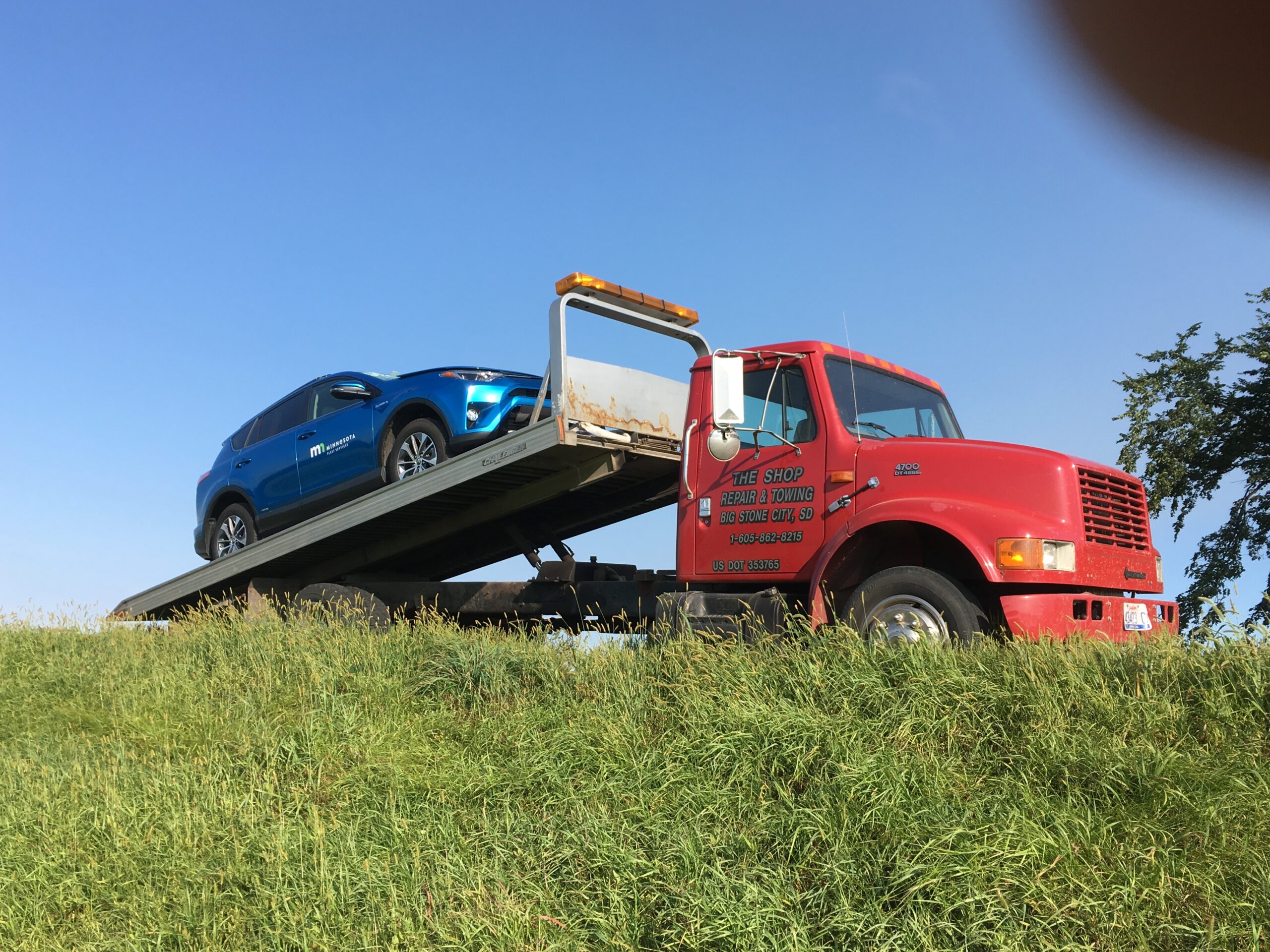 double-parked car towing